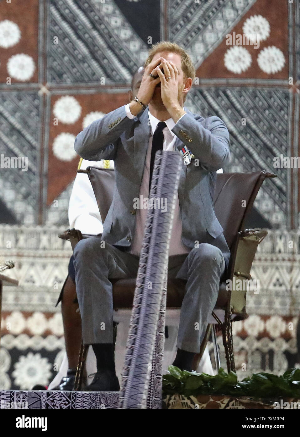 The Duke of Sussex is given a traditional Kava drink as he attends a welcome ceremony at Albert Park in Suva, on day one of the royal couple's visit to Fiji. Stock Photo