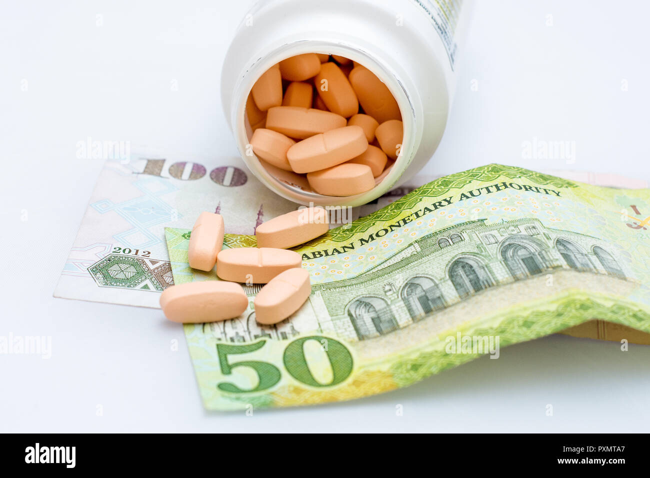 Medicine on Saudi Arabia money, banknotes detailed background photo texture, health insurance, medical concept Stock Photo