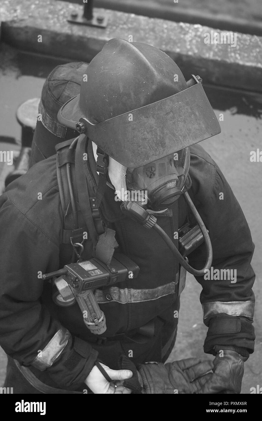 fire fighter wearing breathing apparatus Stock Photo
