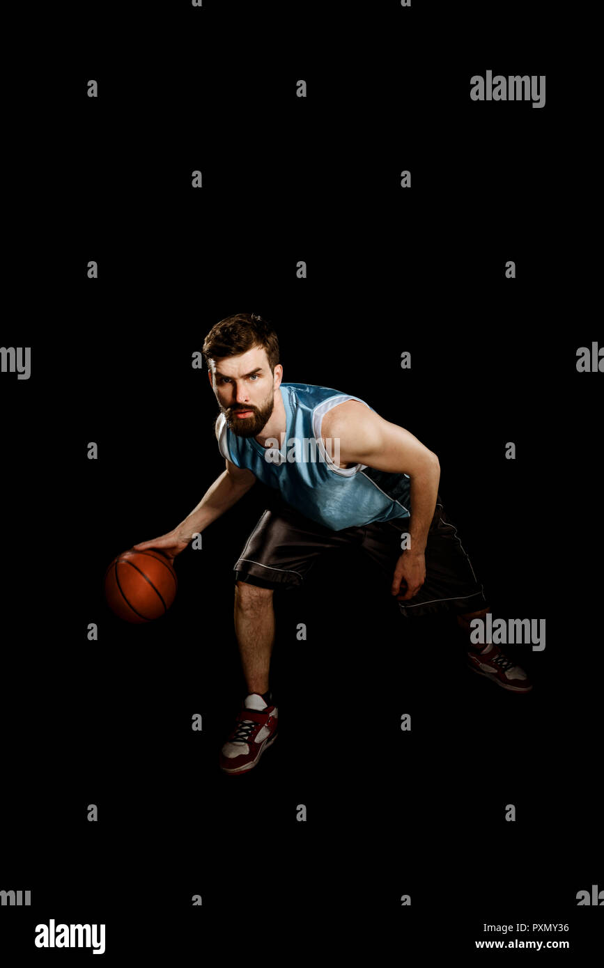 Skilled sportsman dribbling a ball Stock Photo