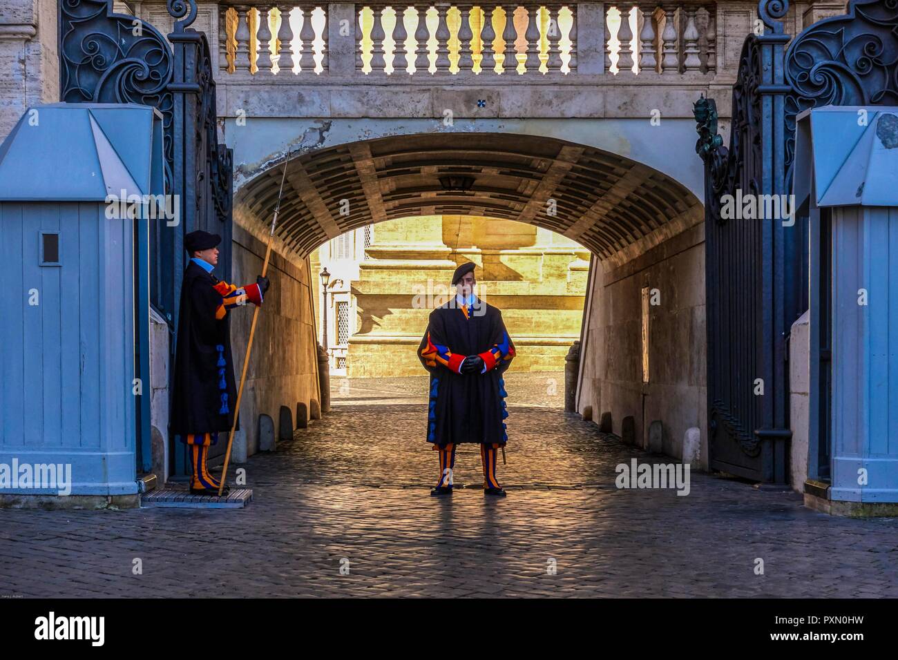 Rome, Vatican. Soldiers of the Swiss Guard protecting the entrance gates of the Vatican since 1506 Stock Photo