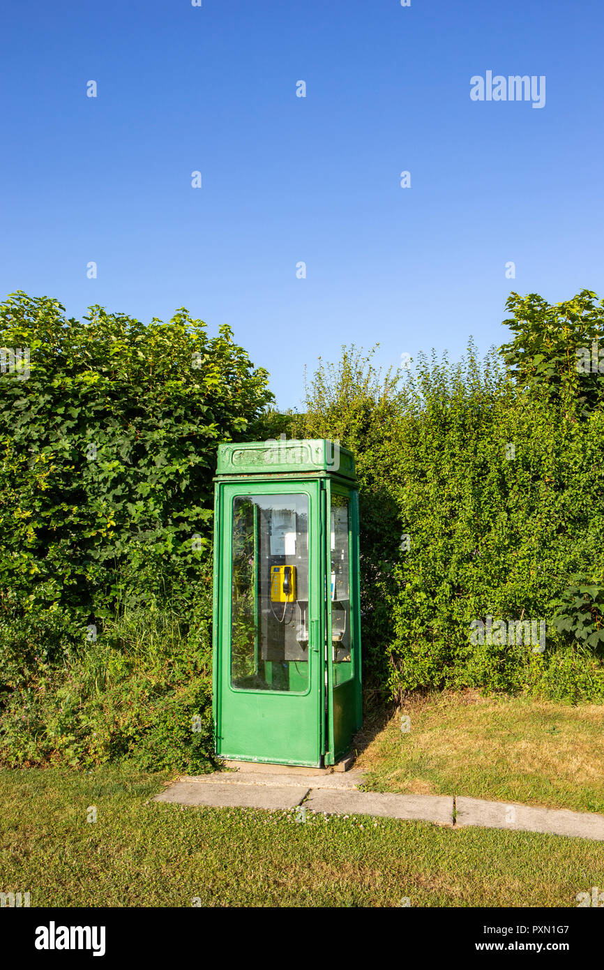 Green painted telephone box on a campsite in Wales UK Stock Photo