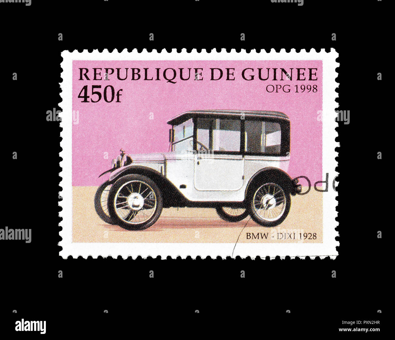 Cancelled postage stamp printed by Guinea, that shows BMW dixi vehicle from 1928, circa 1998. Stock Photo