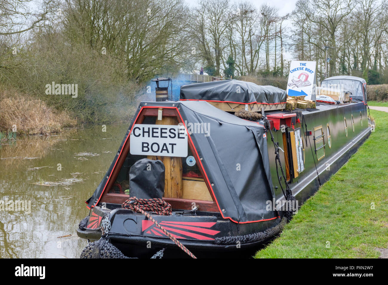 Canal narrowboat selling cheese, moored on the Grand Union Canal, Foxton Locks Market Harborough Stock Photo