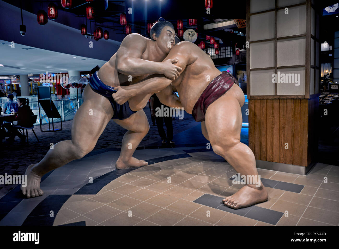Sumo wrestlers. Statue of Sumo fighters featured at a Japanese ...