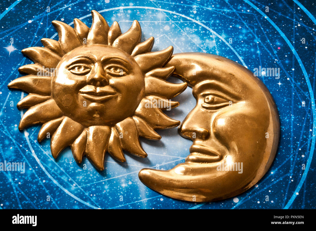 moon and sun decorative objects with face, on an astral chart Stock Photo