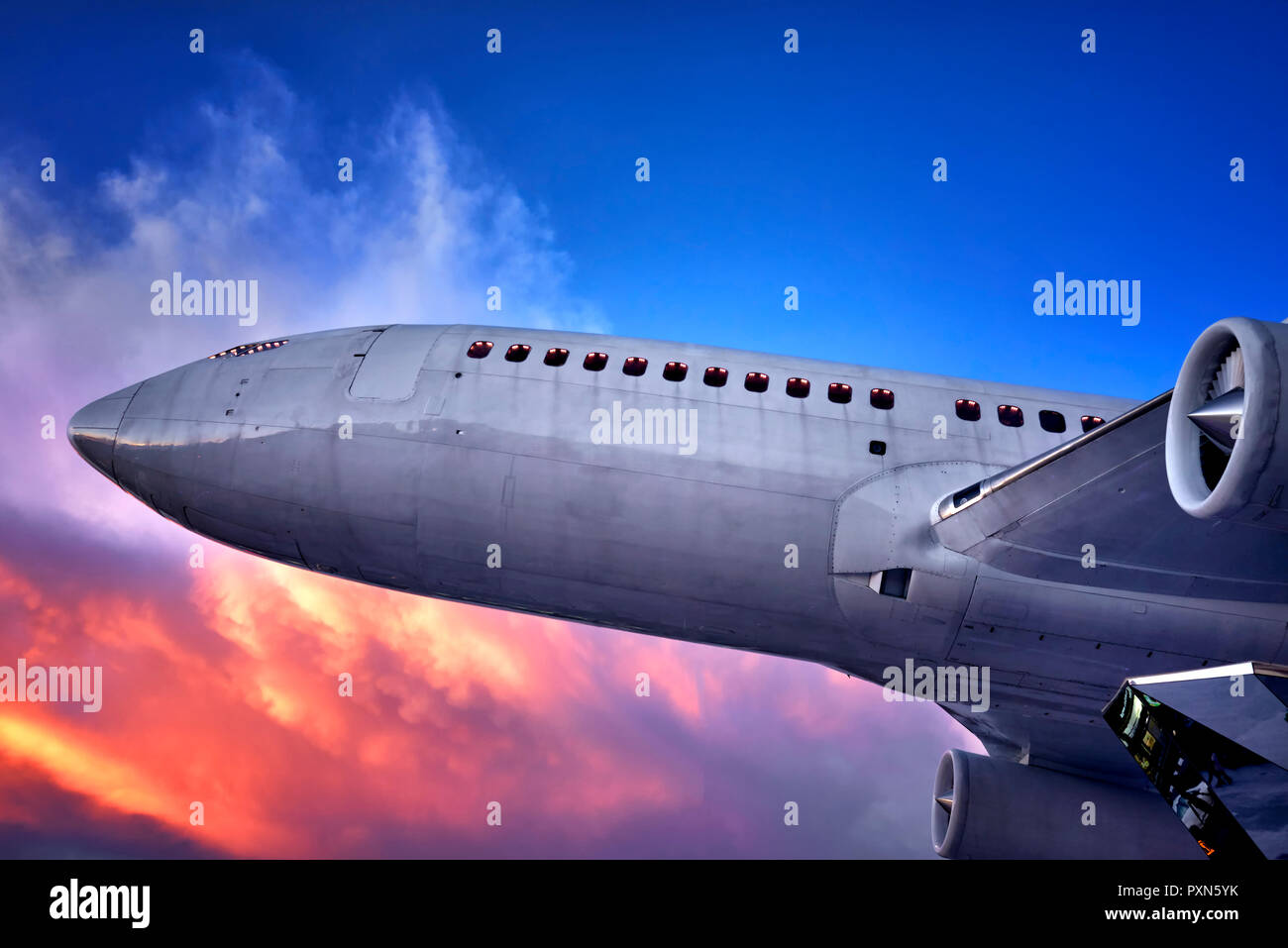 Airplane. Ground based aircraft against a dramatic sky. Jumbo airliner. Stock Photo