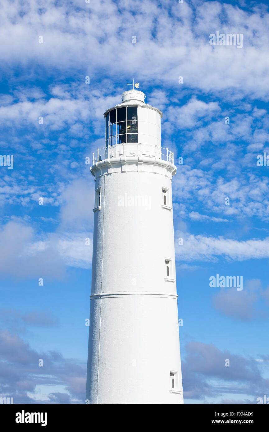 White lighthouse against a bright summer sky Stock Photo