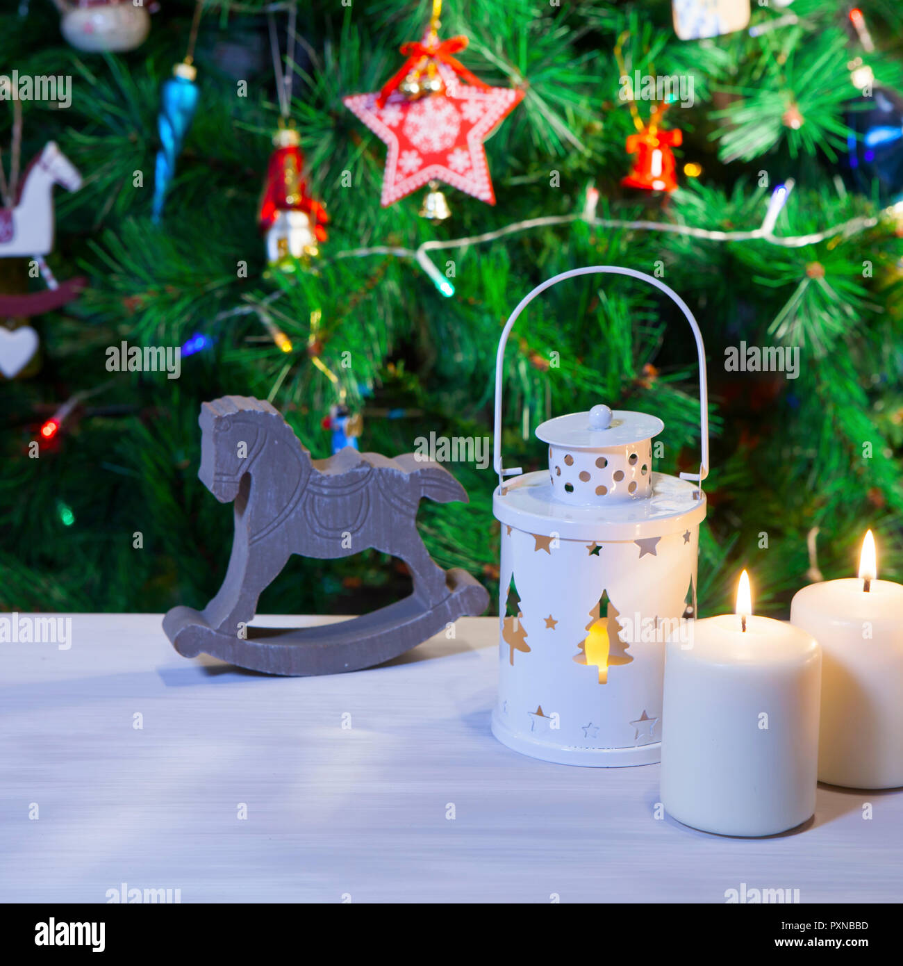 The Christmas Mood Candles And Lantern Under The Christmas Tree As A New Year Card Stock Photo Alamy