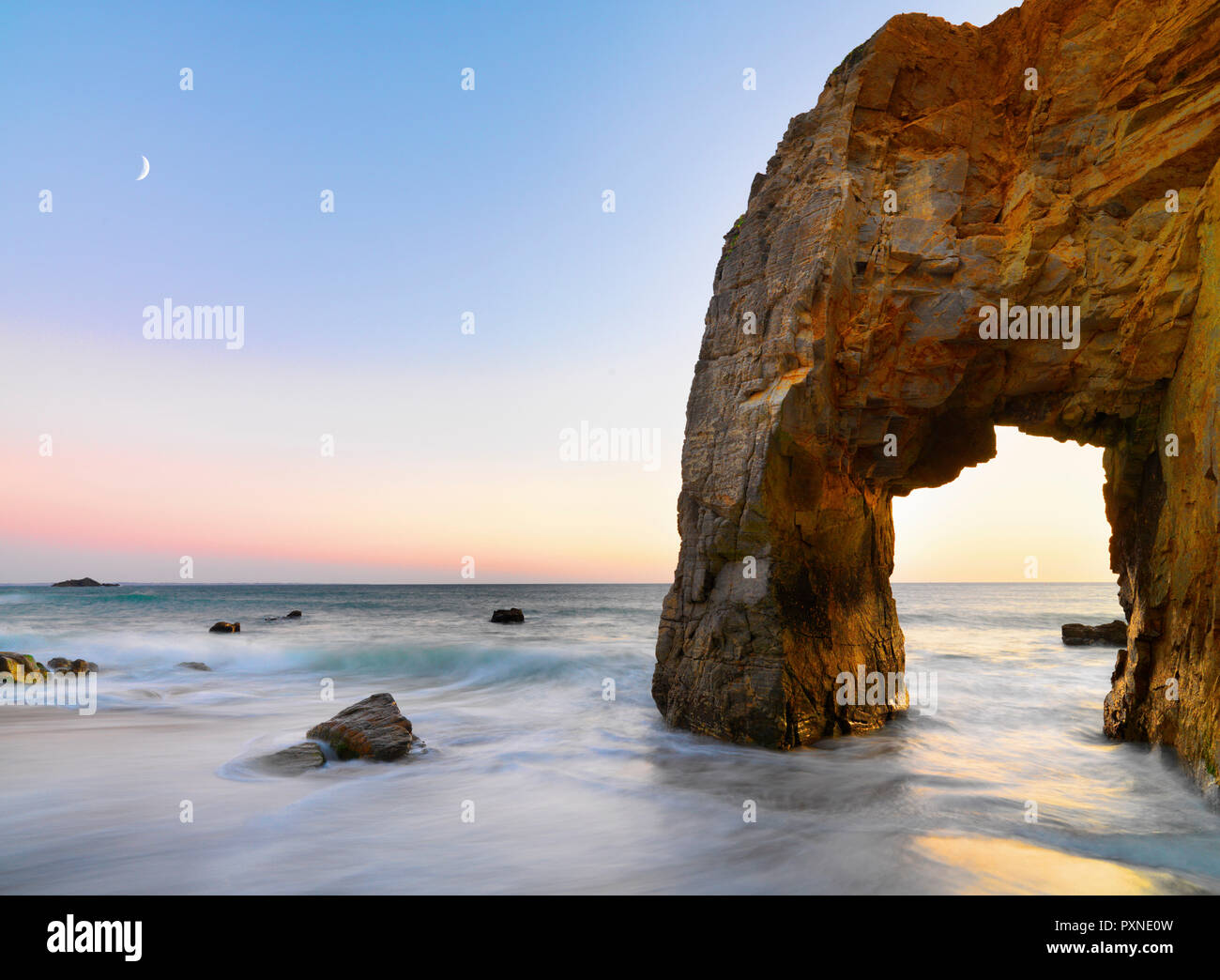 France, Brittany, Morbihan, Cote Sauvage, Quiberon Peninsula, The Arch at Port Blanc at dusk Stock Photo