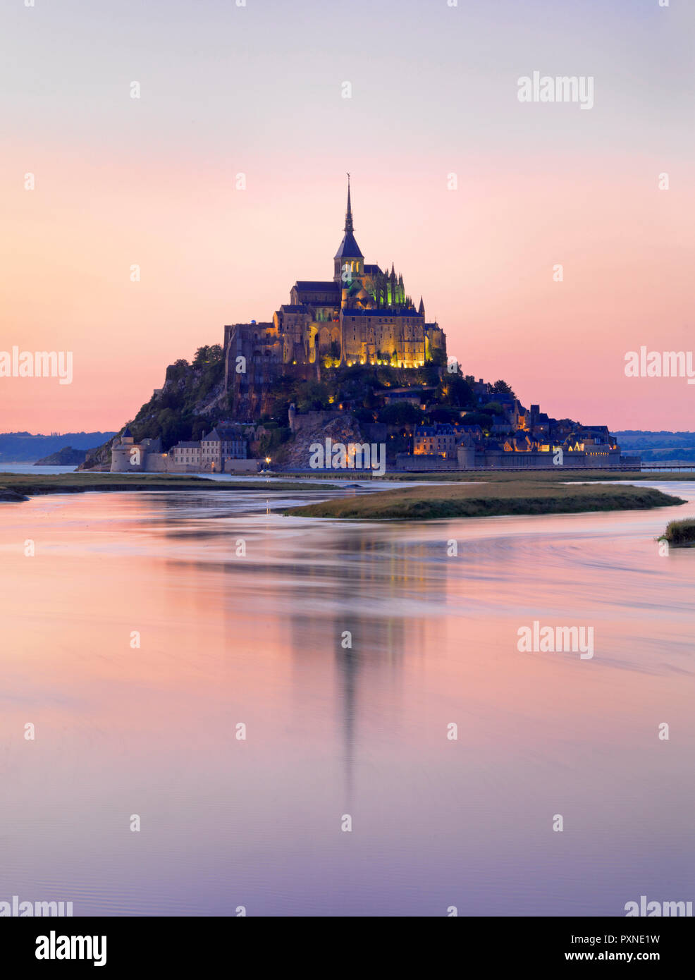 France, Normandy, Le Mont Saint Michel reflected in river at night Stock Photo