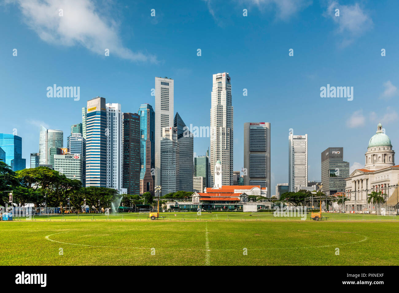 Padang field and financial district skyline, Singapore Stock Photo