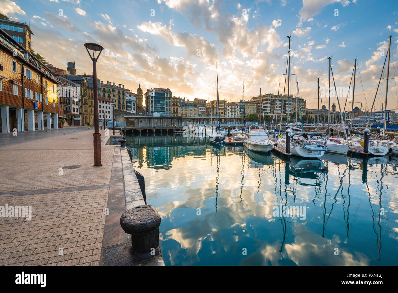 Spain, Basque Country, San Sebastian (Donostia). Harbour at sunrise. Stock Photo