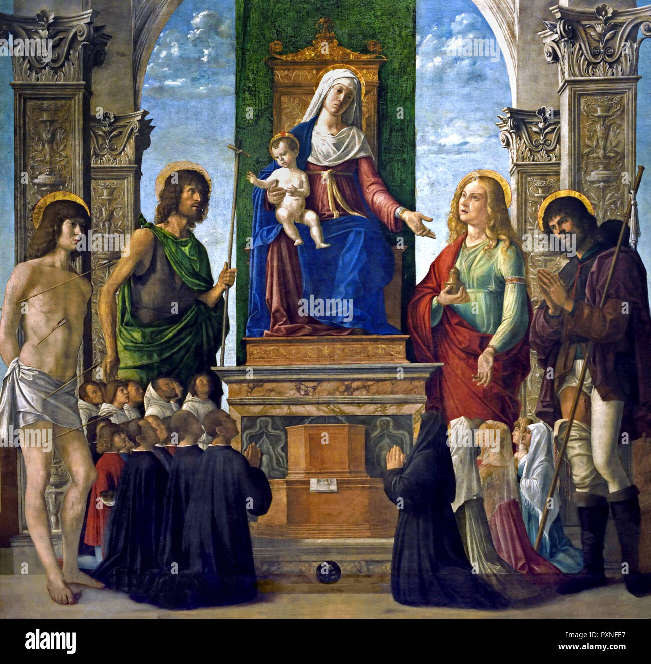 Madonna and Child Enthroned with St. Sebastian, St. John the Baptist, St. Mary Magdalen, St. Roch and Members of the Confraternity of San Giovanni Evangelista 1487 - 1488 by Cima da Conegliano (Giovanni Battista Cima), 1459-1517, Italy, Italian . Stock Photo