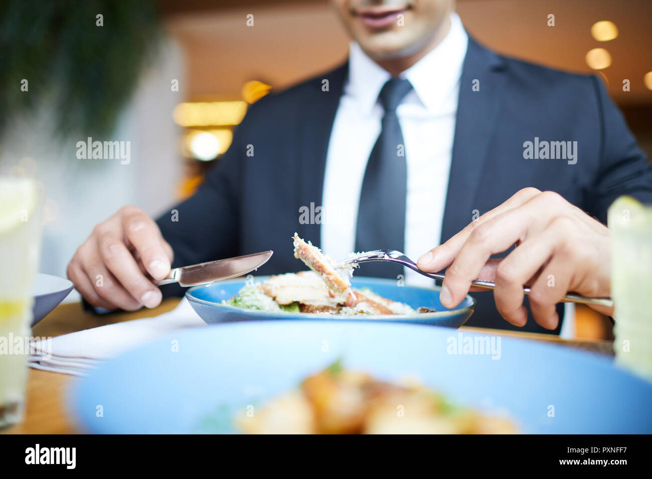 Man holding fork and knife hi-res stock photography and images - Alamy