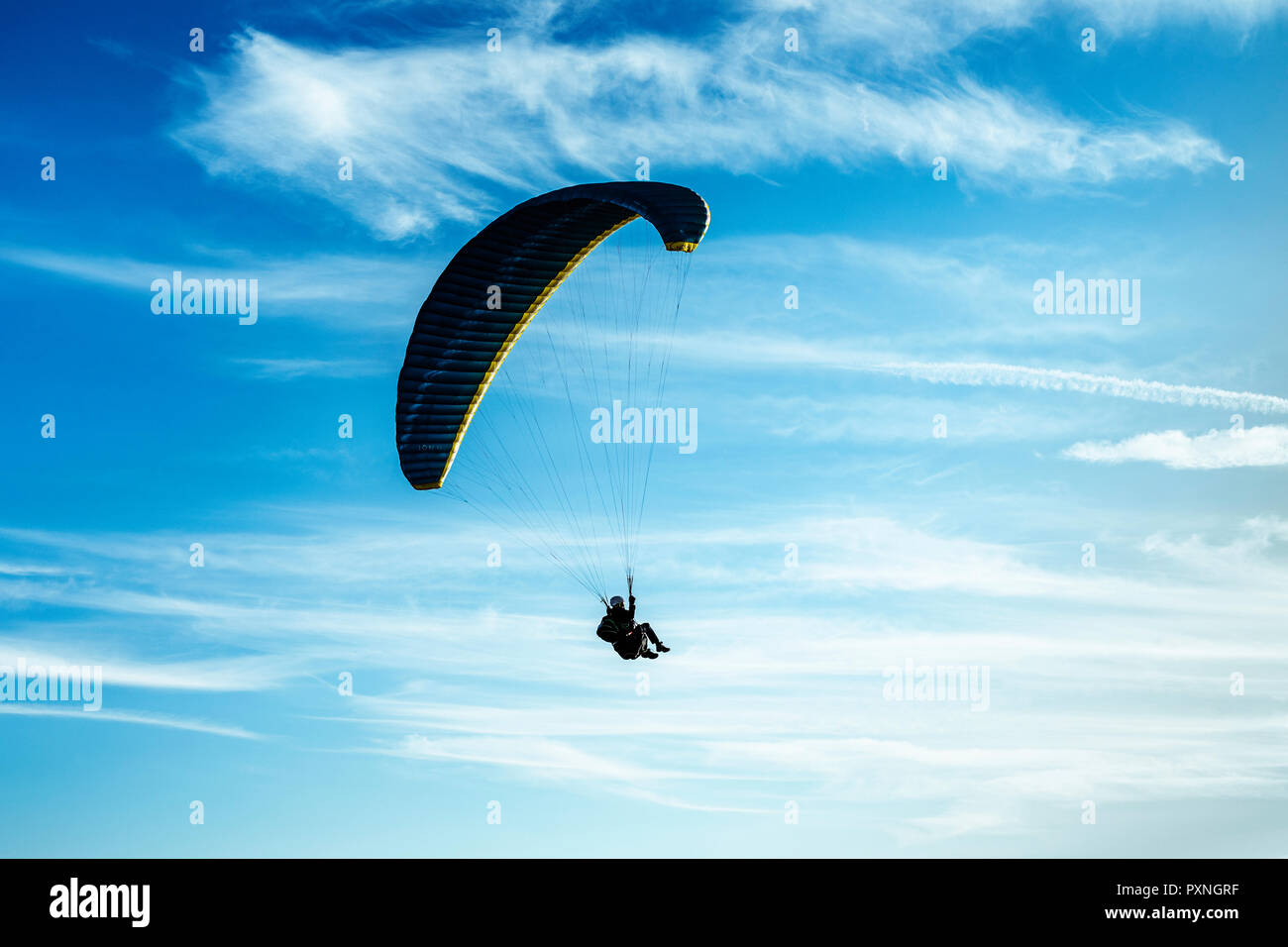 Paragliding, paraglider, blue sky with clouds Stock Photo