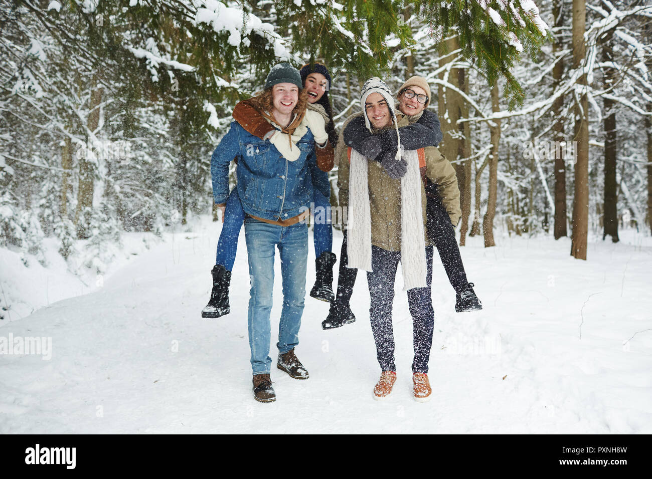 Couples playing in the snow hi-res stock photography and images - Alamy