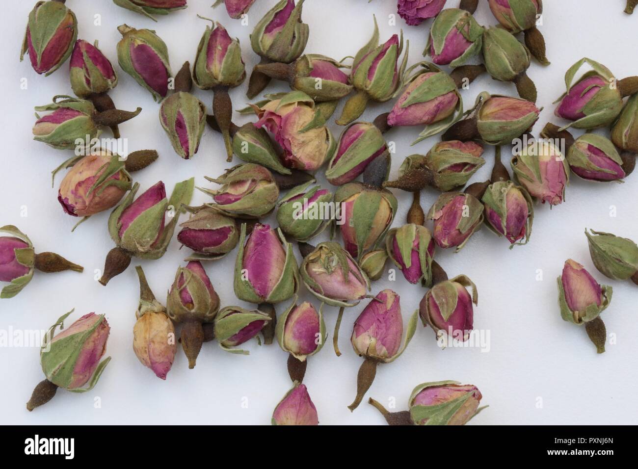 Dry Roses for Tea. Stack of dry roses for homemade scented and flavored tea. Stock Photo