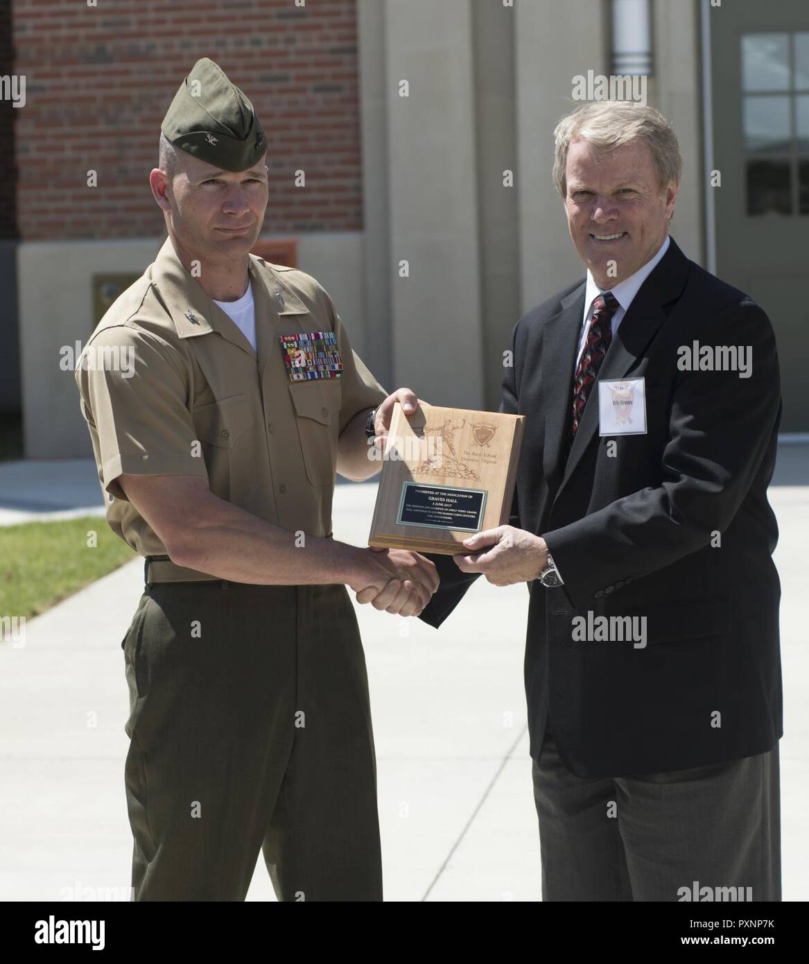 U.S. Marine Corps Col. Mark H. Clingan, left, commanding officer of The