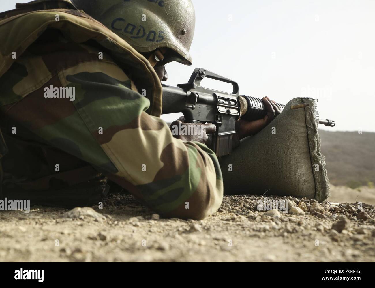 A soldier with Senegal's 5th Contingent in Mali fires an M16A2 rifle during  an unknown distance range as part of a peacekeeping operations training  mission alongside U.S. Marines with Special Purpose Marine