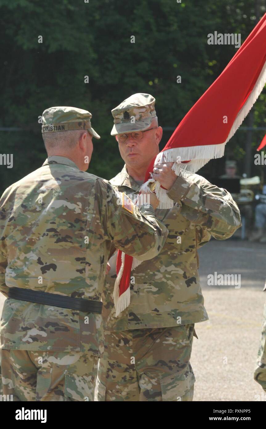 U.S. Army Reserve Command Sgt. Maj. Dennis Law accepts the colors from Brig. Gen. Daniel J. Christian, commander, 412th Theater Engineer Command, during a change of responsibility ceremony at the George A. Morris Army Reserve Center in Vicksburg, Miss., June 10, 2017. Law takes over the Command’s top enlisted position from Command Sgt. Maj. Richard Castelveter who retires after more than 35 years of honorable service. Stock Photo