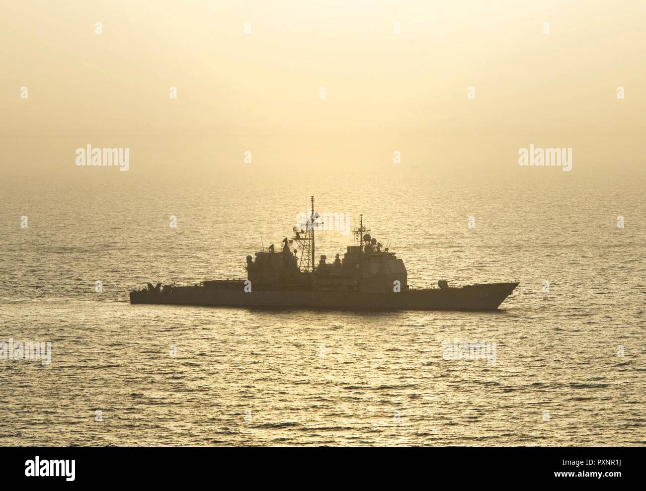 ARABIAN GULF (June 18, 2017) The guided-missile cruiser USS Vella Gulf (CG 72) steams through the Arabian Gulf during Exercise Spartan Kopis 17, June 18.  Exercise Spartan Kopis is a Task Force (TF) 55-led exercise between the U.S. Navy and U.S. Coast Guard in order to increase tactical proficiency, broaden levels of cooperation, enhance mutual capability and support long-term security and stability in the region. Vella Gulf is deployed to the U.S. 5th Fleet area of operations to reassure allies and partners, and preserve the freedom of navigation and the free flow of commerce in the region. Stock Photo