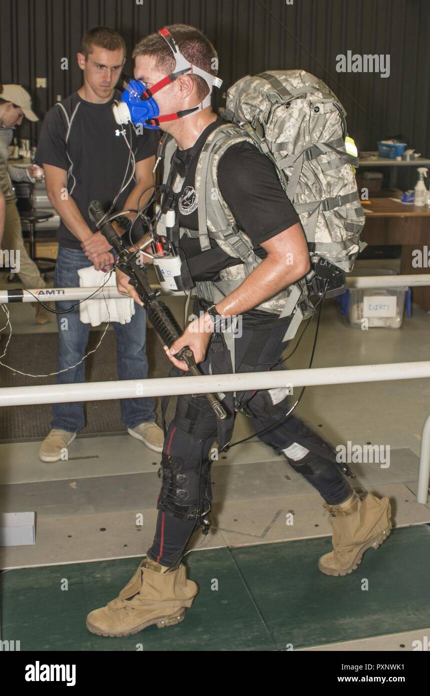 A Soldier wears an exosuit while on a treadmill at a U.S. Army Research Laboratory facility at Aberdeen Proving Ground, Maryland. The suit, which is part of the Army's Warrior Web Program has pulleys and gears designed to prevent and reduce musculoskeletal injuries caused by dynamic events typically found in the warfighter's environment. Researchers use the feedback gained for ongoing research and developments as they continue to refine the prototypes. Stock Photo