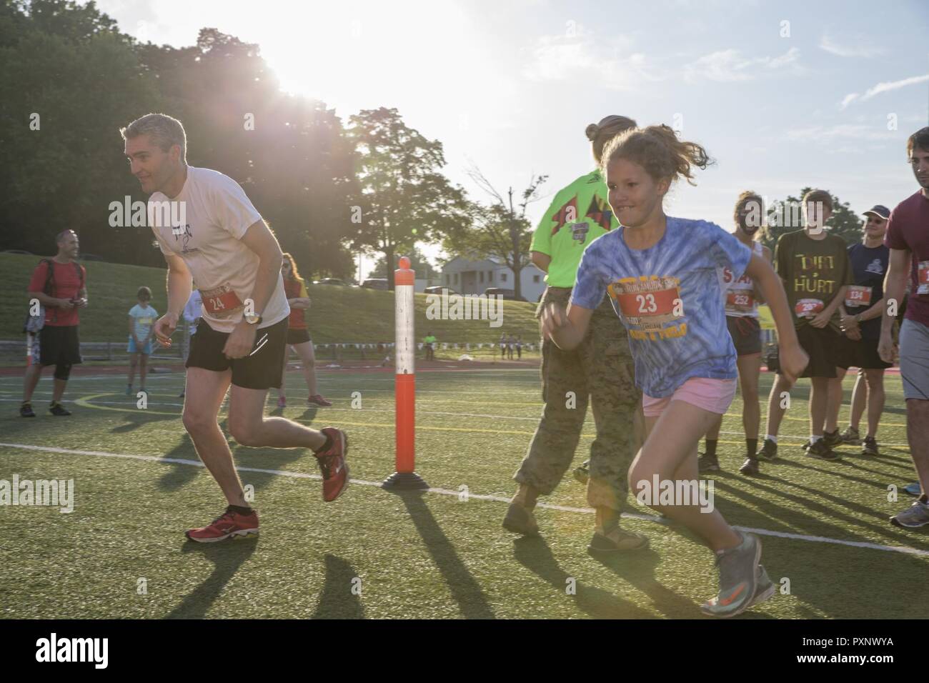Participants run to an obstacle during the annual Marine Corps Marathon