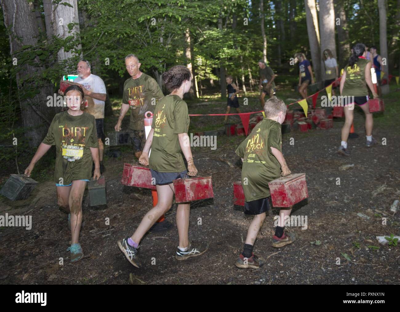 Participants maneuver through an obstacle during the annual Marine Corps Marathon (MCM) Run