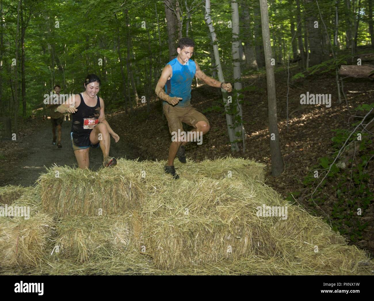 Participants maneuver through an obstacle during the annual Marine Corps Marathon (MCM) Run