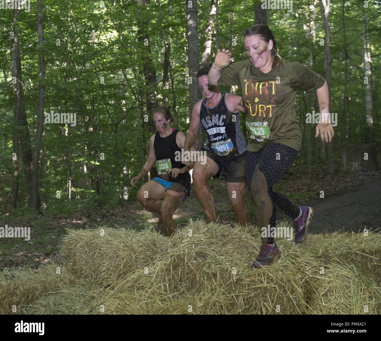 Participants maneuver through an obstacle during the annual Marine Corps Marathon (MCM) Run