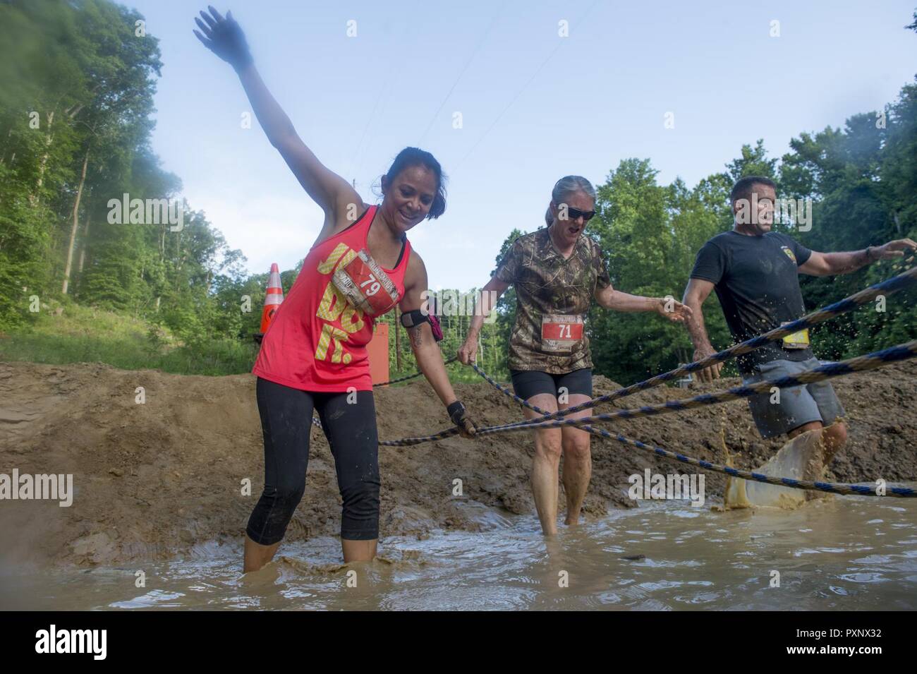 Participants of the annual Marine Corps Marathon (MCM) Run Amuck race maneuver through an