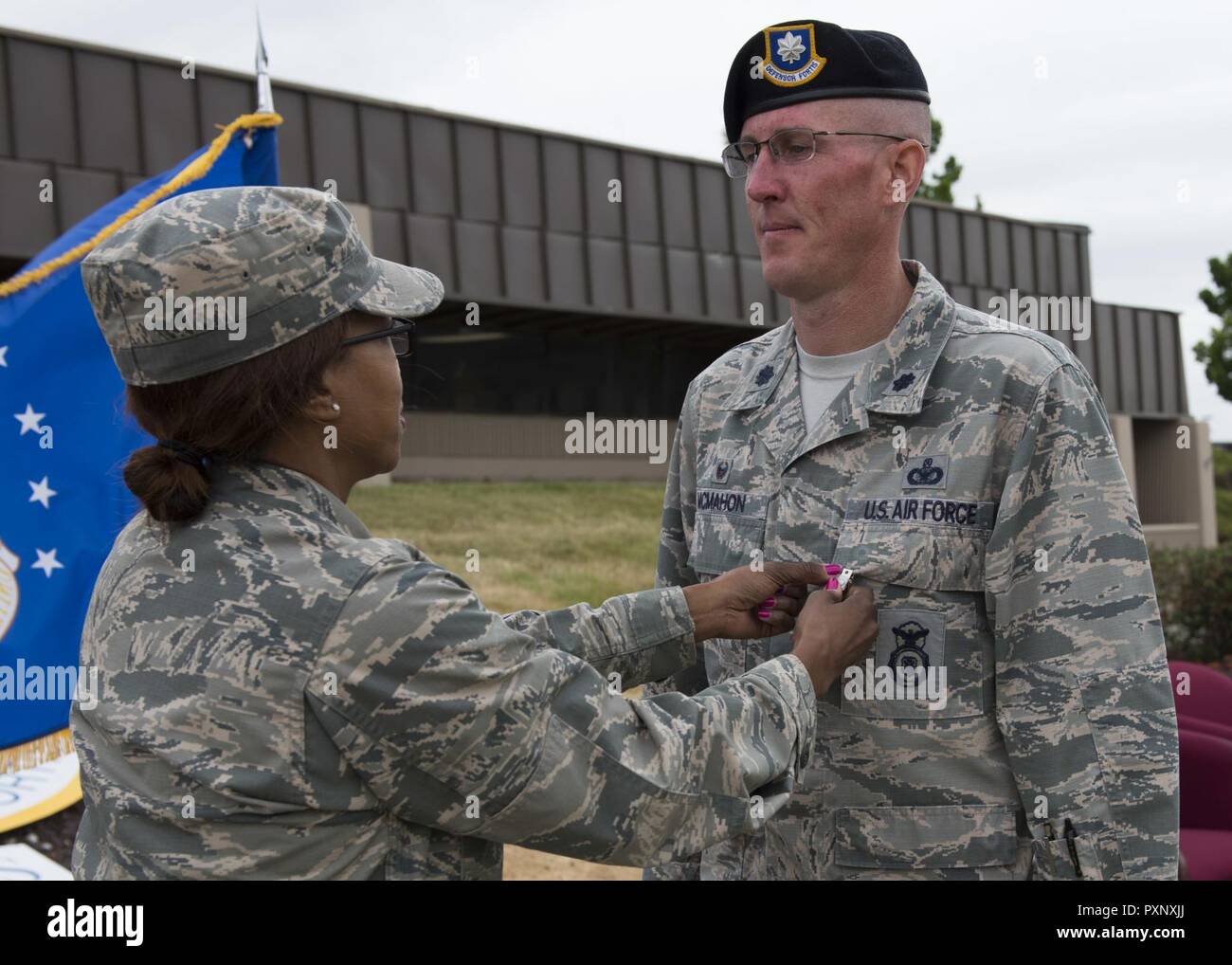 Col. Yvonne Spencer, 92nd Mission Support Group commander, pins a