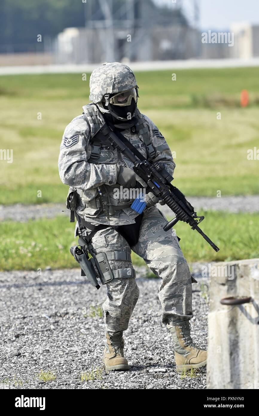Staff Sgt. Farrell Bowers, 434th Security Forces Squadron fire team member maneuvers through a dynamic tactical training scenario, June 4 at Grissom Air Reserve Base, Ind. This training allows SFS members to improve readiness for real life tactical situations. Stock Photo