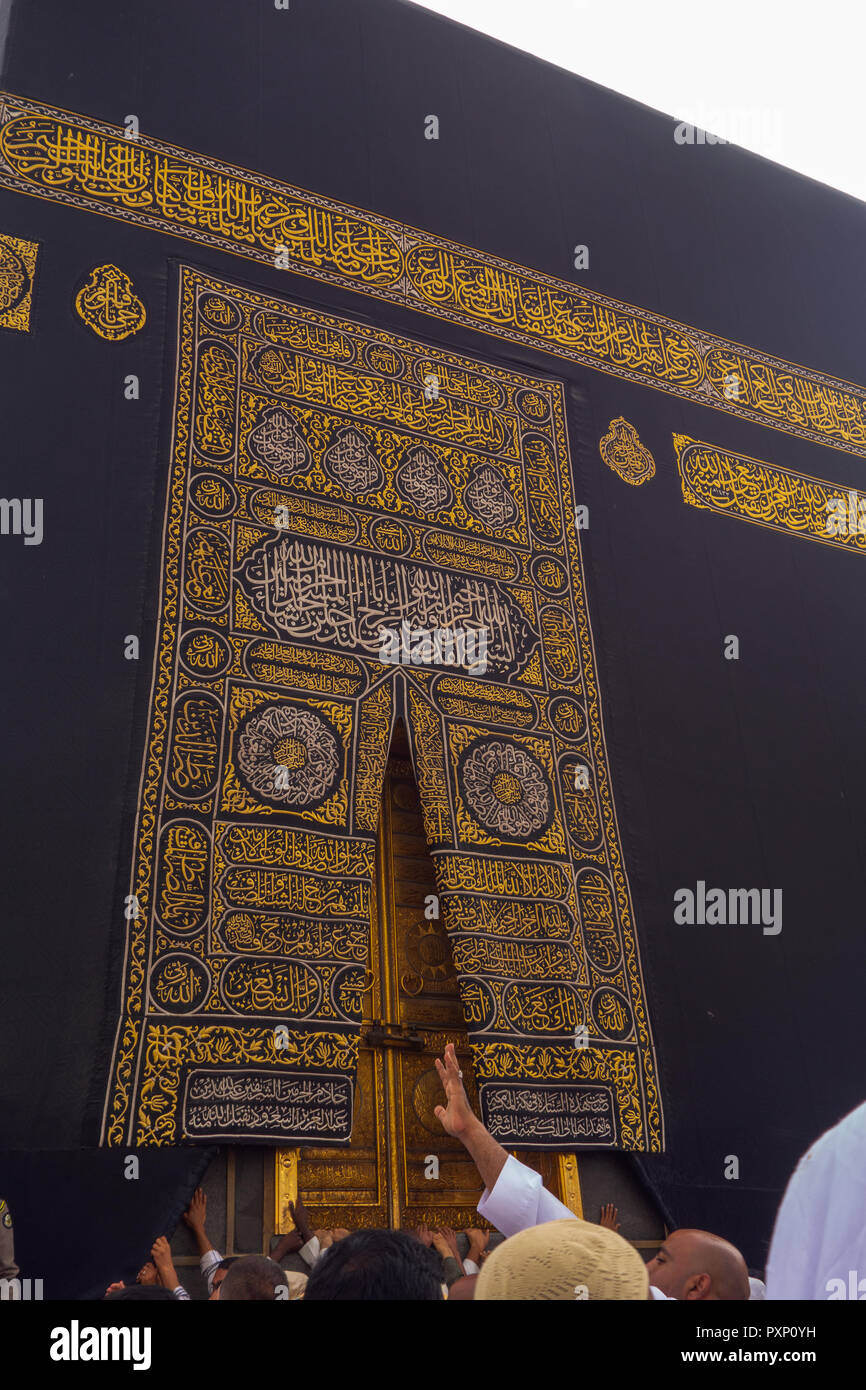 MAKKAH - CIRCA 2013 : A close up view of kaaba door and the kiswah (cloth that covers the kaaba) at Masjidil Haram  in Makkah, Saudi Arabia. The door  Stock Photo