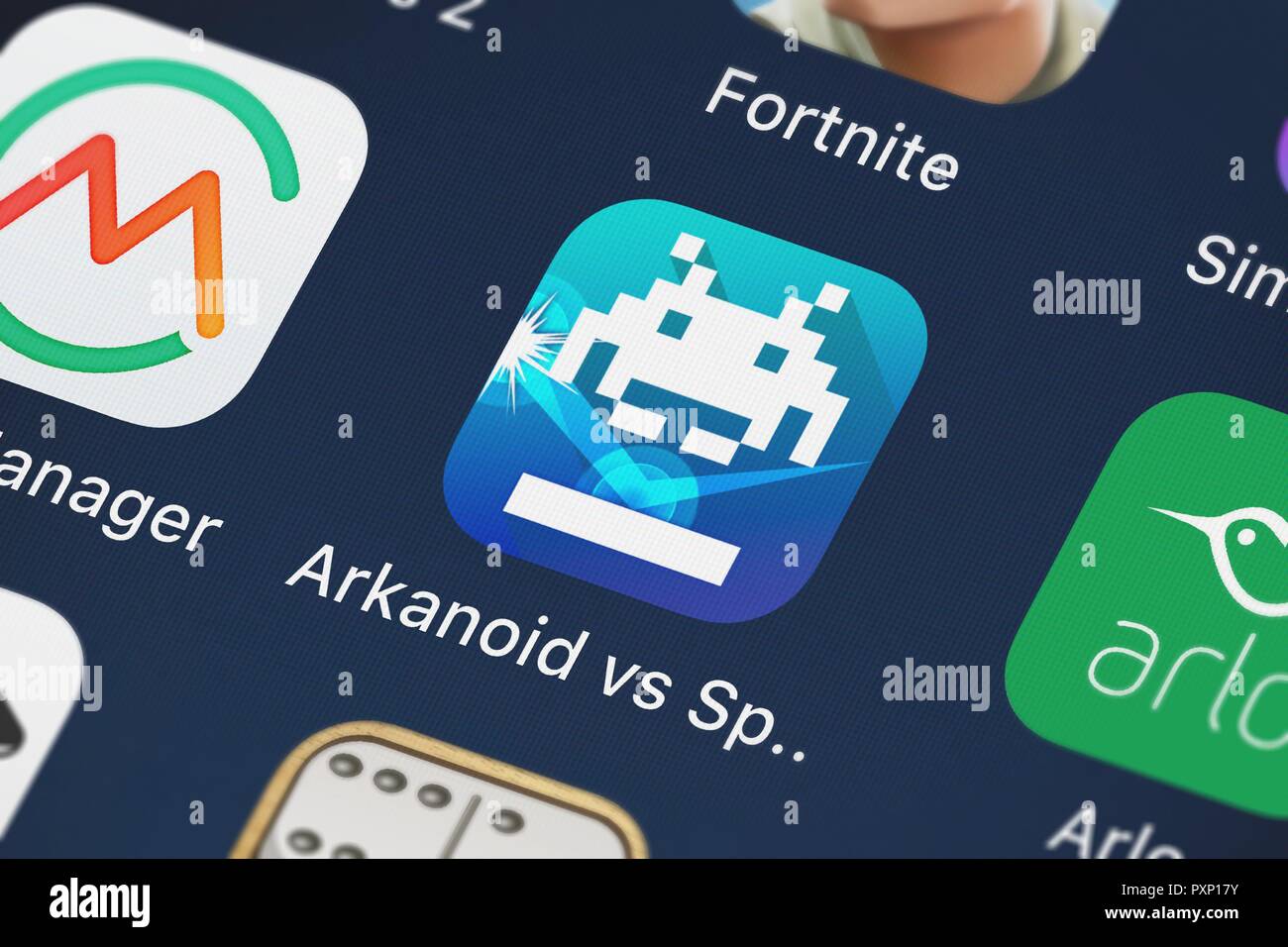 London, United Kingdom - October 23, 2018: Close-up shot of the Arkanoid vs Space Invaders mobile app from SQUARE ENIX INC. Stock Photo