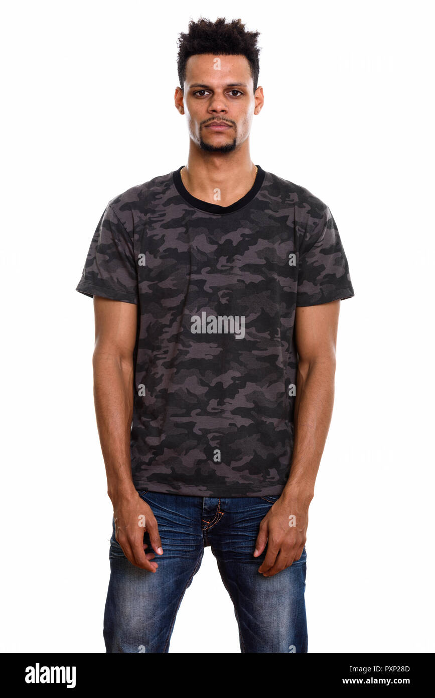 Studio shot of young African man standing Stock Photo - Alamy