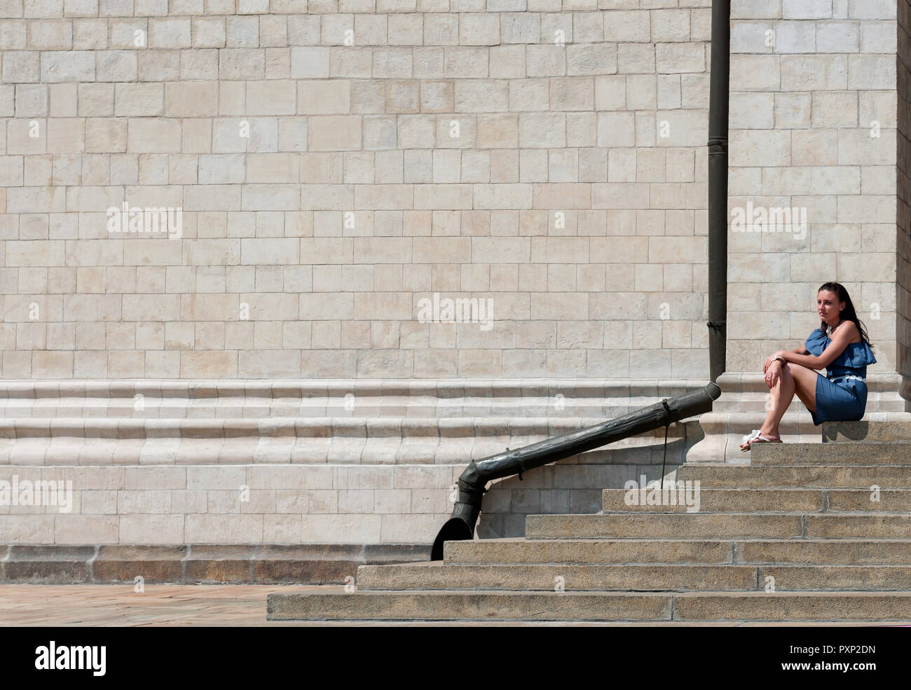 Portrait of a beautiful european woman sitting on steps Stock Photo