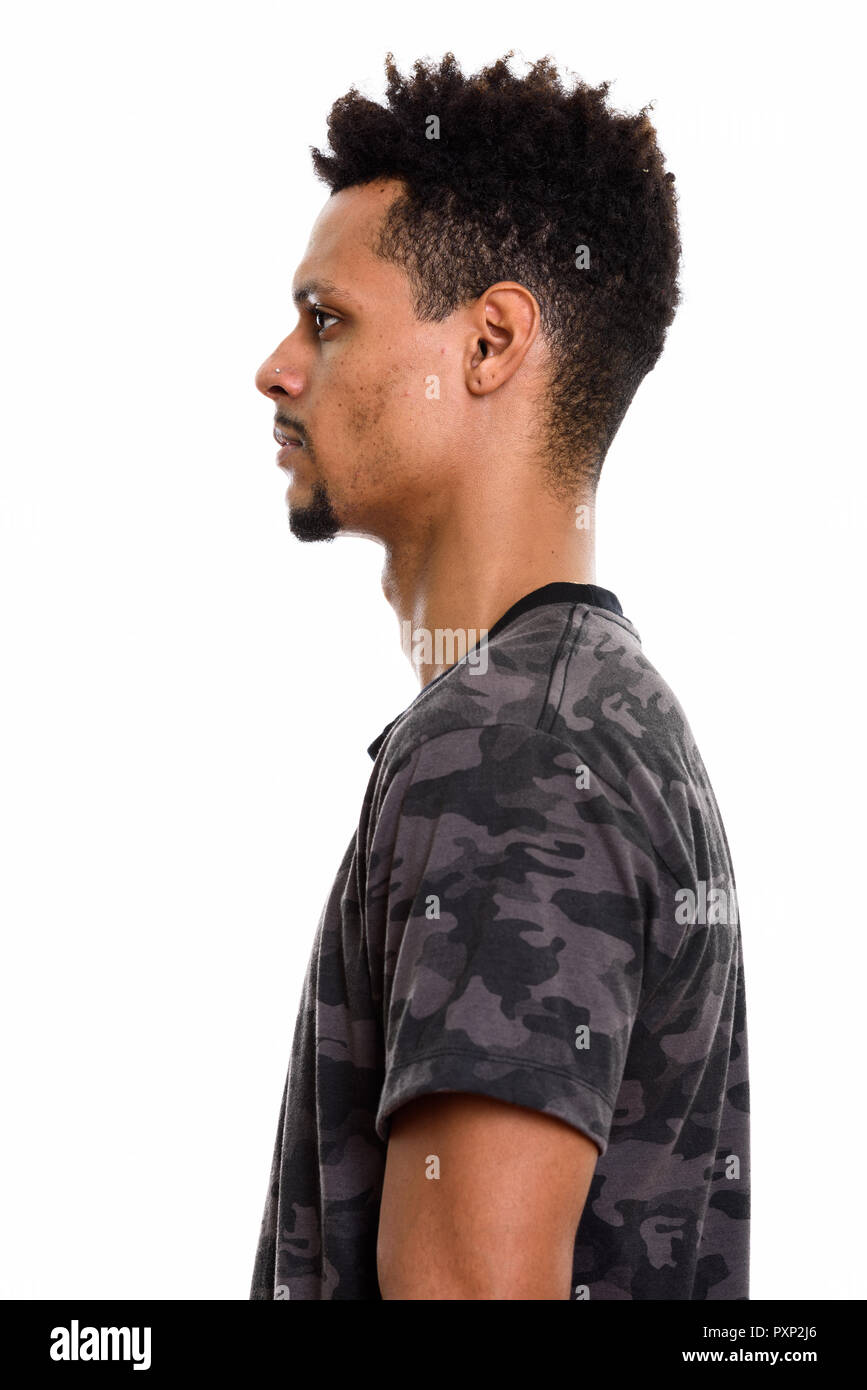 Profile view of young handsome African man standing Stock Photo