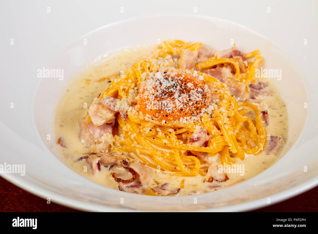 Italian pasta Carbonara with ham and yolk Stock Photo Alamy