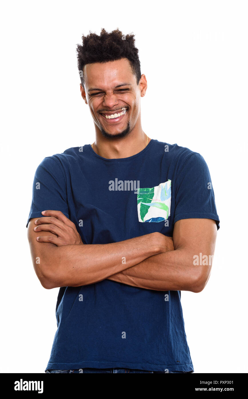 Studio shot of young happy African man smiling with arms crossed Stock Photo