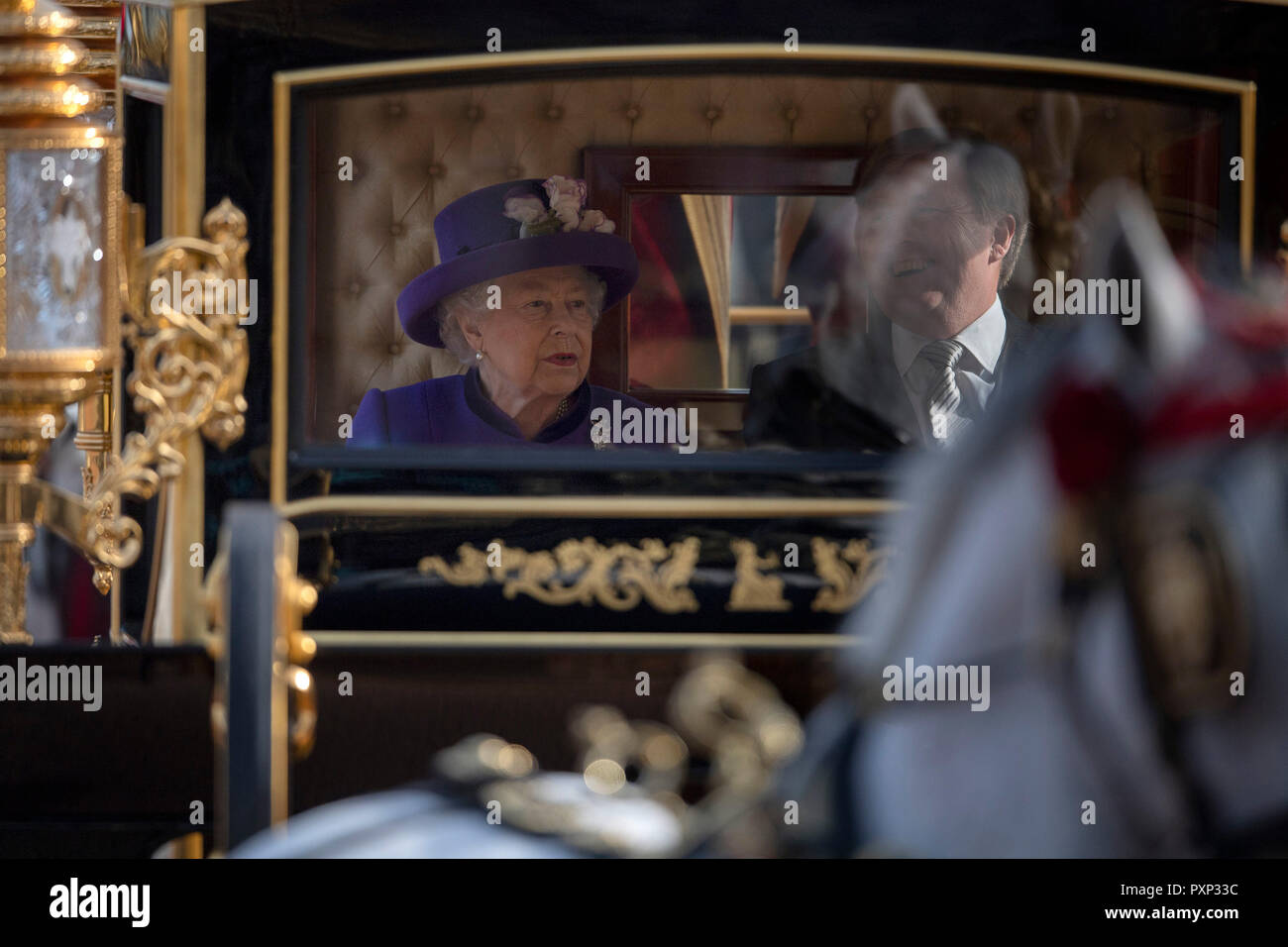 Queen Elizabeth II and King Willem-Alexander in the State Carriage as it arrives at Buckingham Palace, London, during the state visit of King Willem-Alexander and Queen Maxima of the Netherlands. Stock Photo