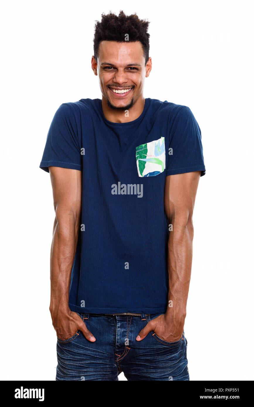 Studio shot of young happy African man smiling and laughing with Stock Photo