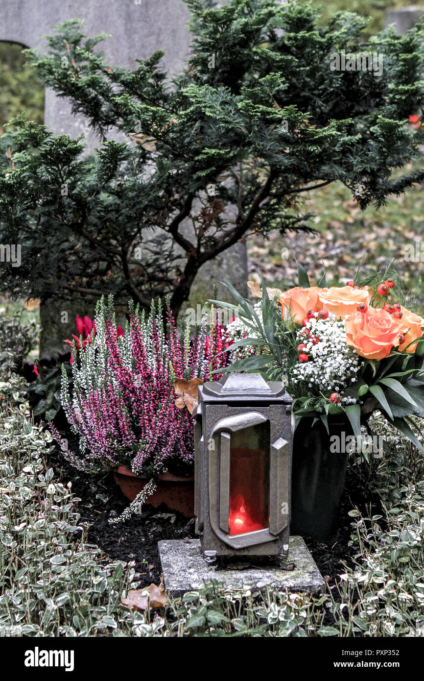 Geschmuecktes Grab auf einem Friedhof an Allerheiligen Stock Photo