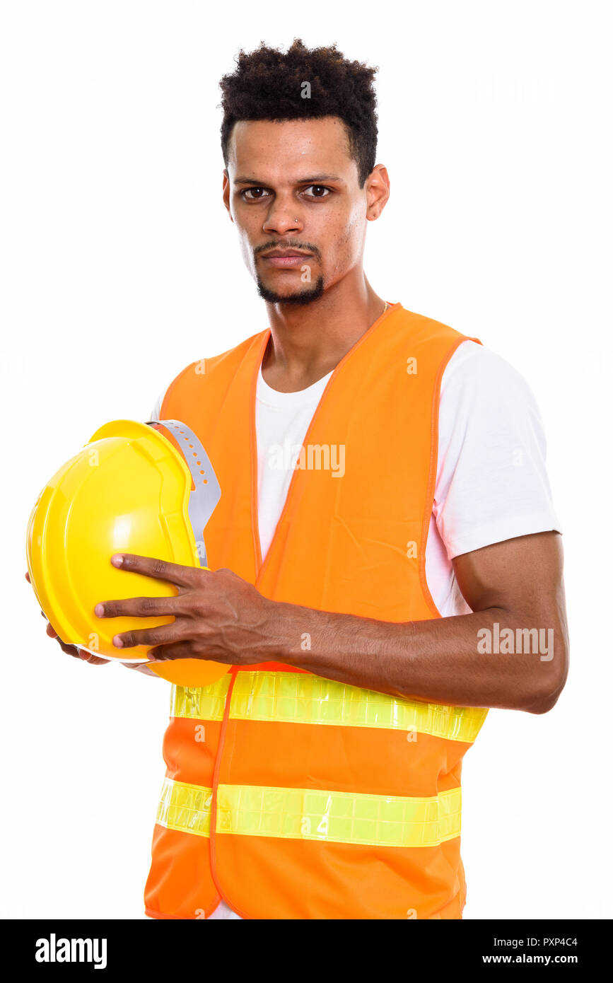 Young African man construction worker holding safety helmet with Stock Photo