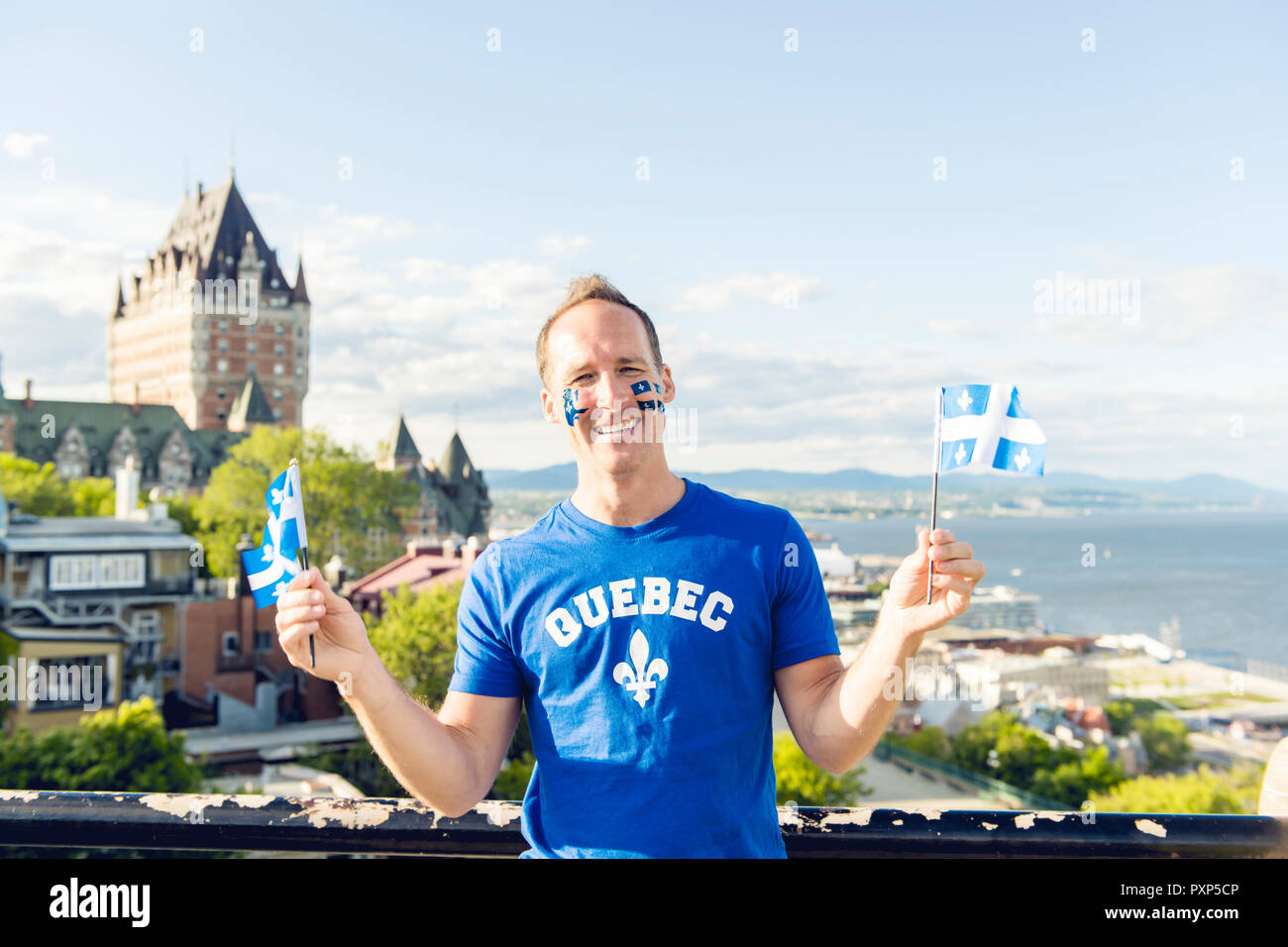 Canadian man holding canadian flag hi-res stock photography and images ...
