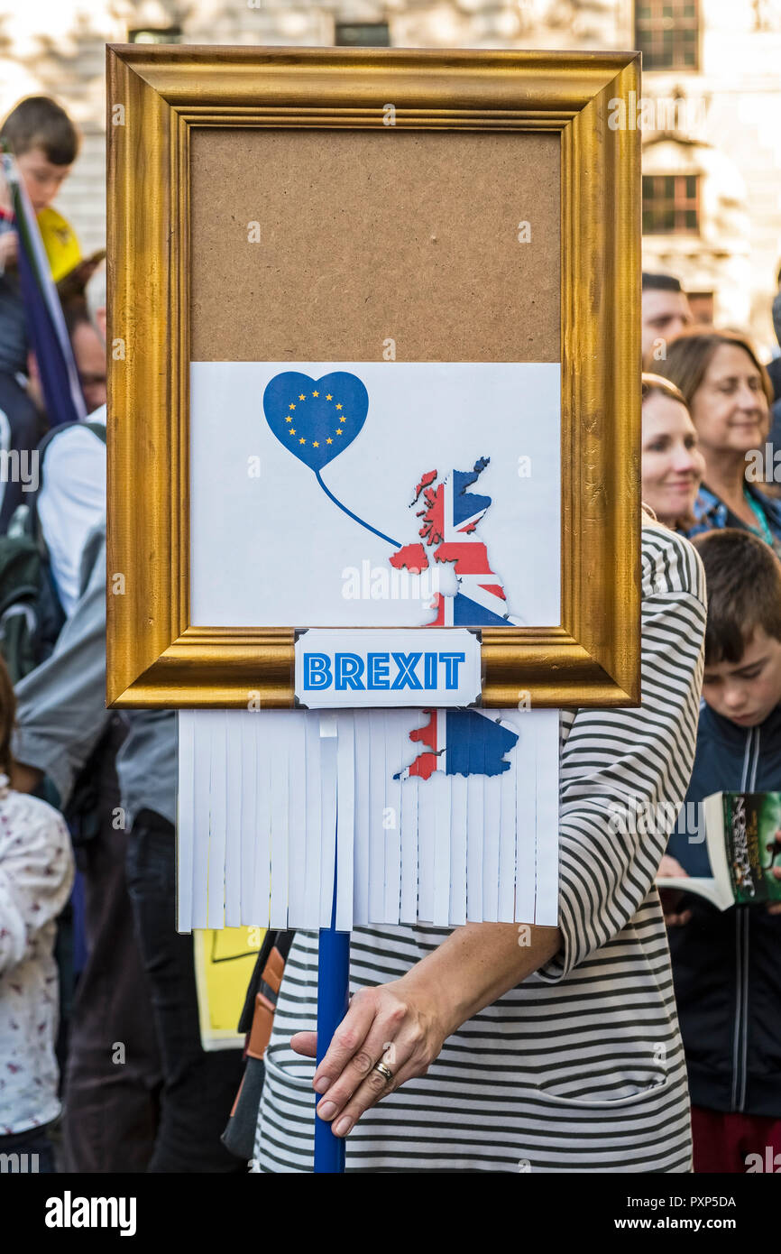 London, UK, October 20 2018. 700,000 marchers demonstrate for a second Brexit referendum. A placard imitates Banksy's famous self-destructing painting Stock Photo