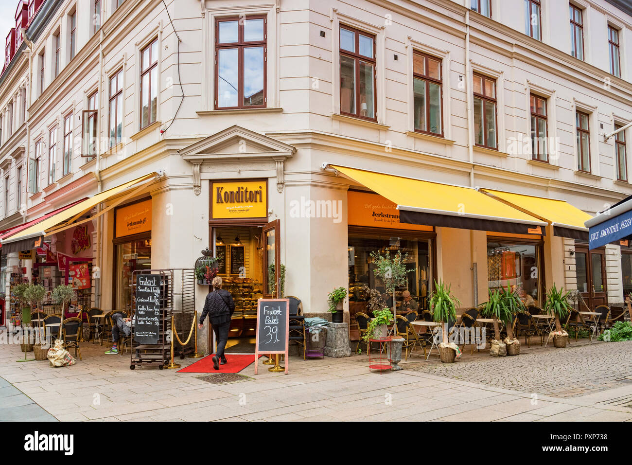 14 September 2018: Gothenburg, Sweden - Woman entering Konditori Restuarant or coffee shop. Stock Photo