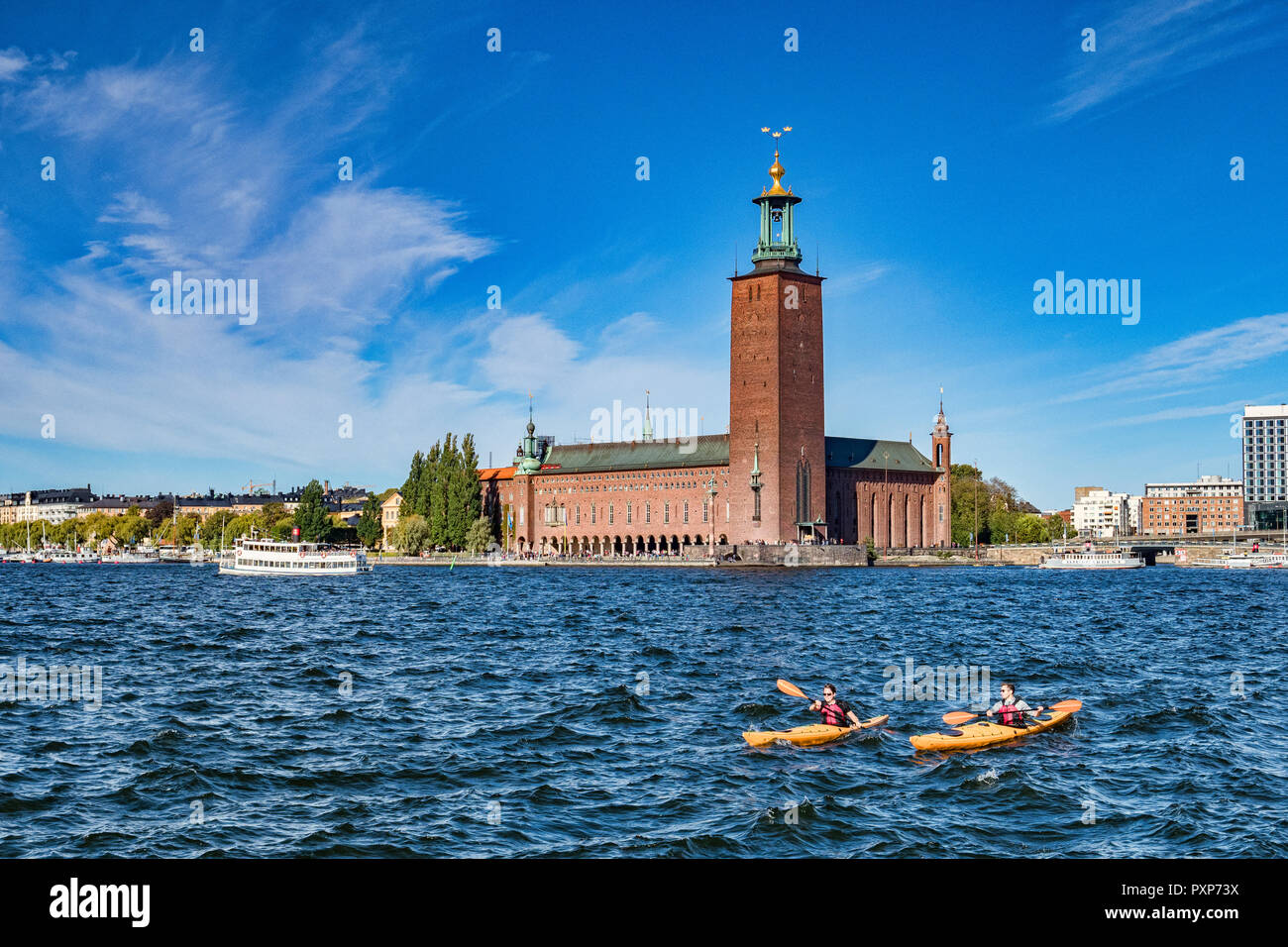 16 September 2018: Stockholm, Sweden - The City Hall, location of the Nobel Banquet, and two kayaks in the water. Stock Photo