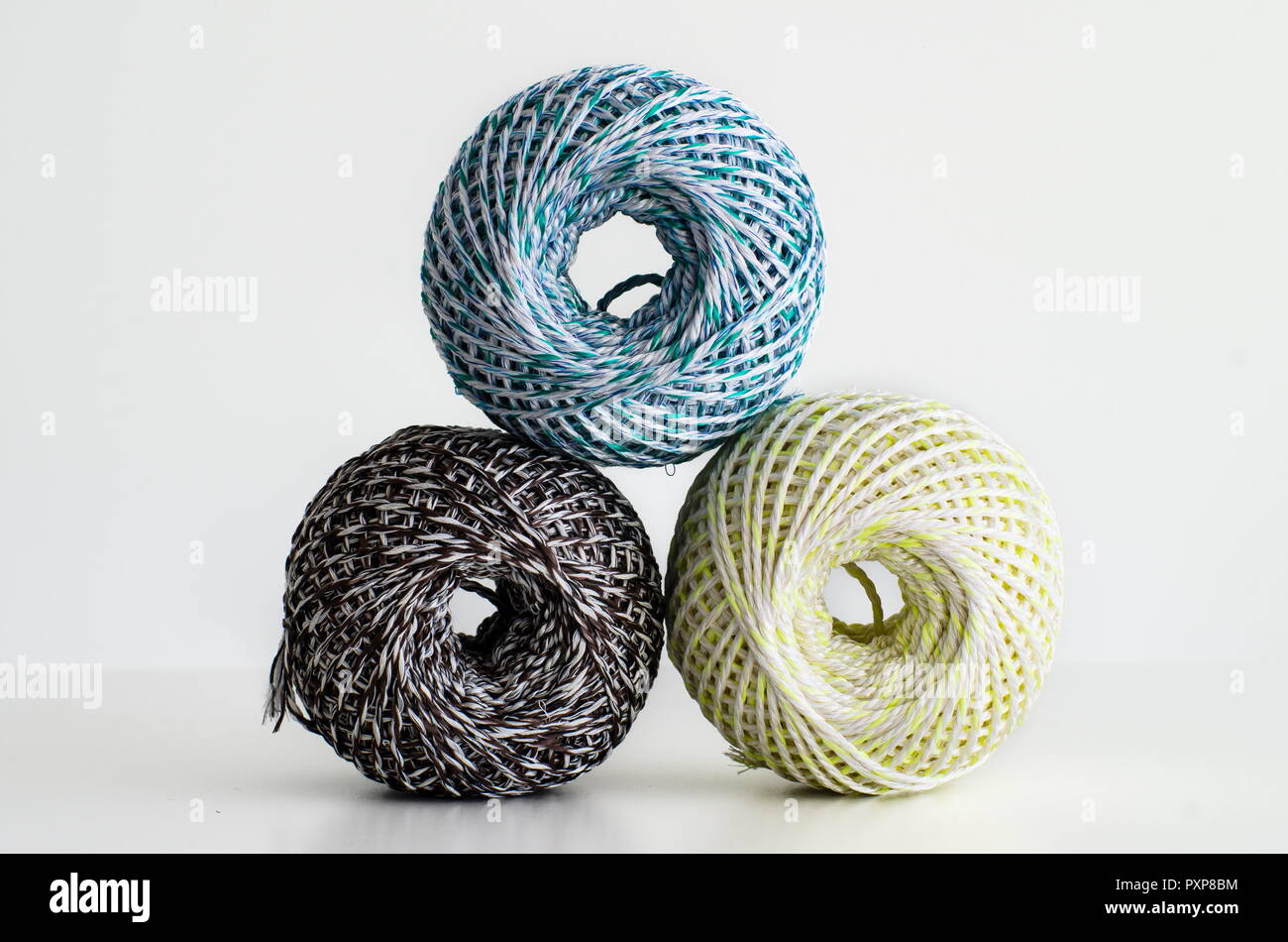 Colorful wool balls against bright white background, isolated Stock Photo